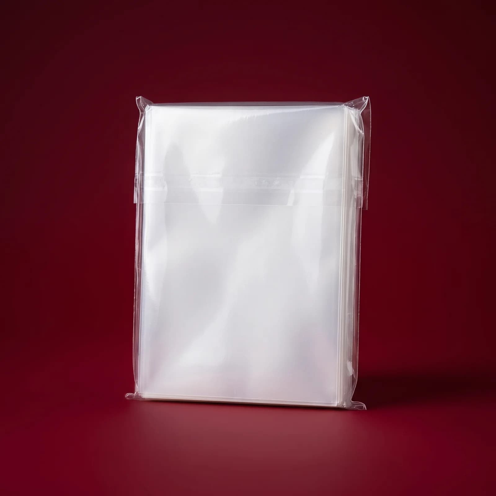 FIRE LION matte sleeve paketi — studiya məhsul fotosu, qırmızı fon